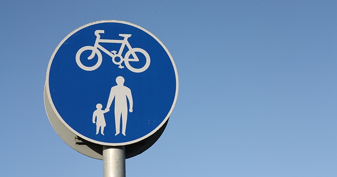 Blue sign showing cyclists and pedestrians walkway