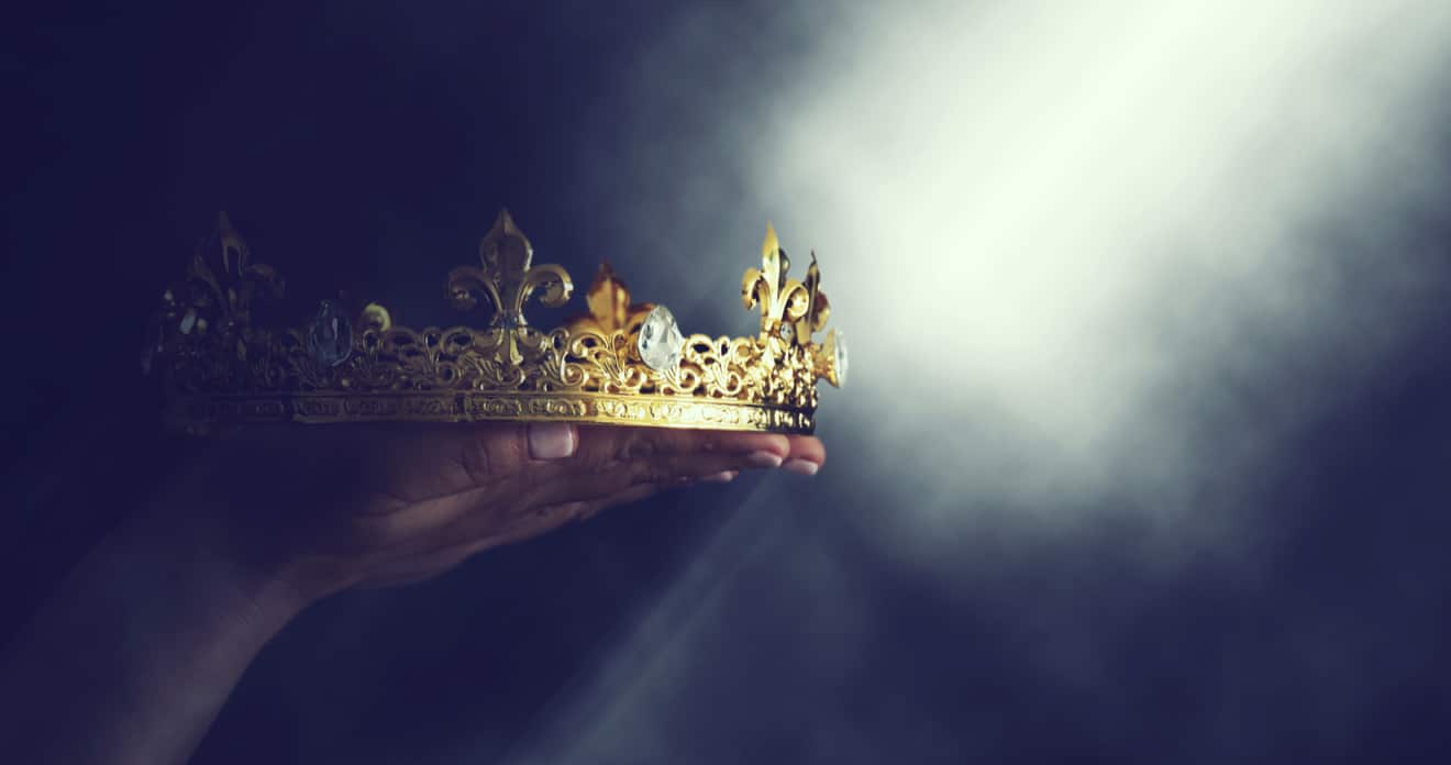 Person holding crown to light